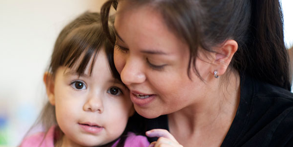 A mother nurturing her child